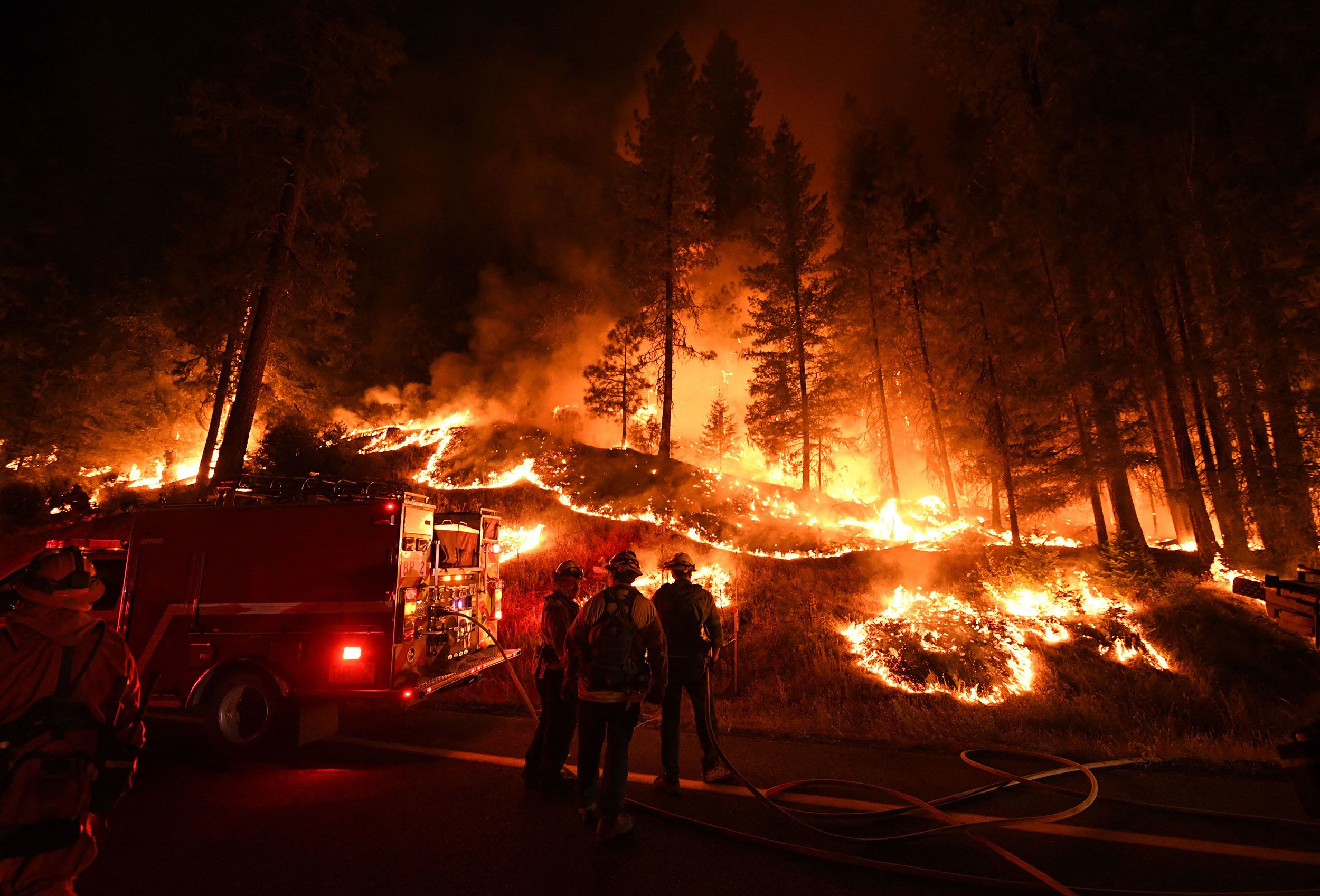 Thousands evacuated as wildfires burn across western US and Canada