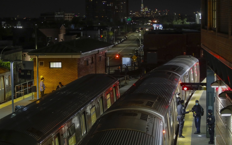 New York City police investigate the death of a woman found on fire in subway car