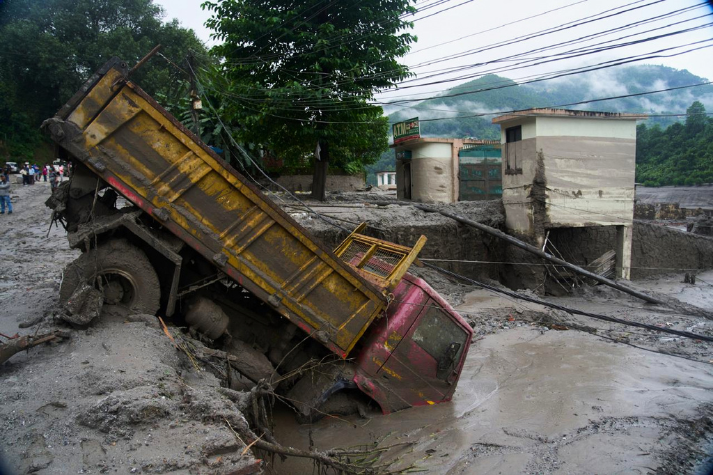 Death toll climbs and hundreds are missing in wake of glacier collapse in Nepal