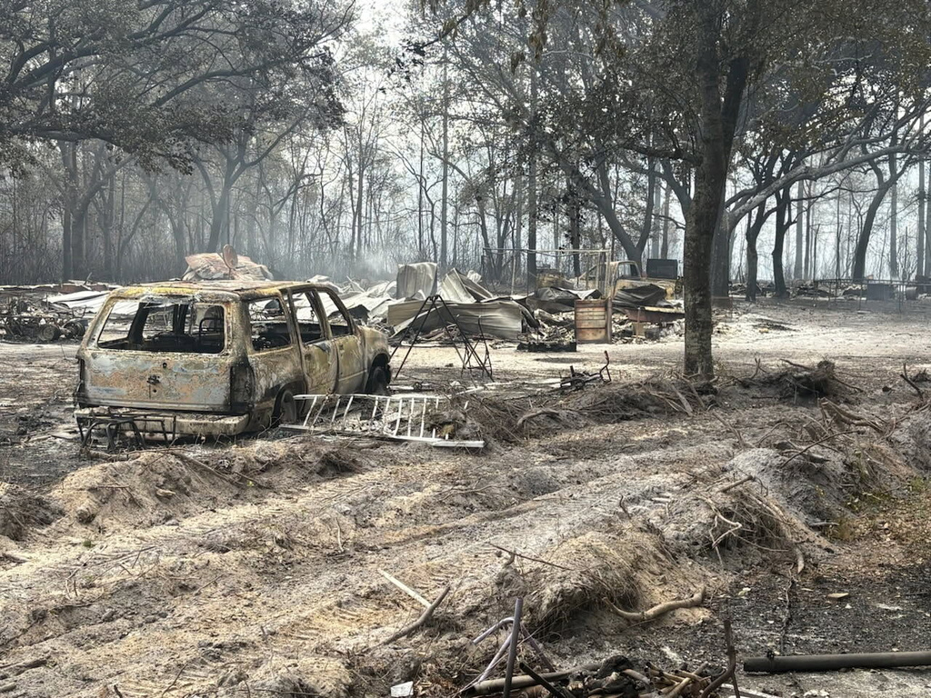 Southern US wildfires force residents to flee, leaving them unsure about fate of houses