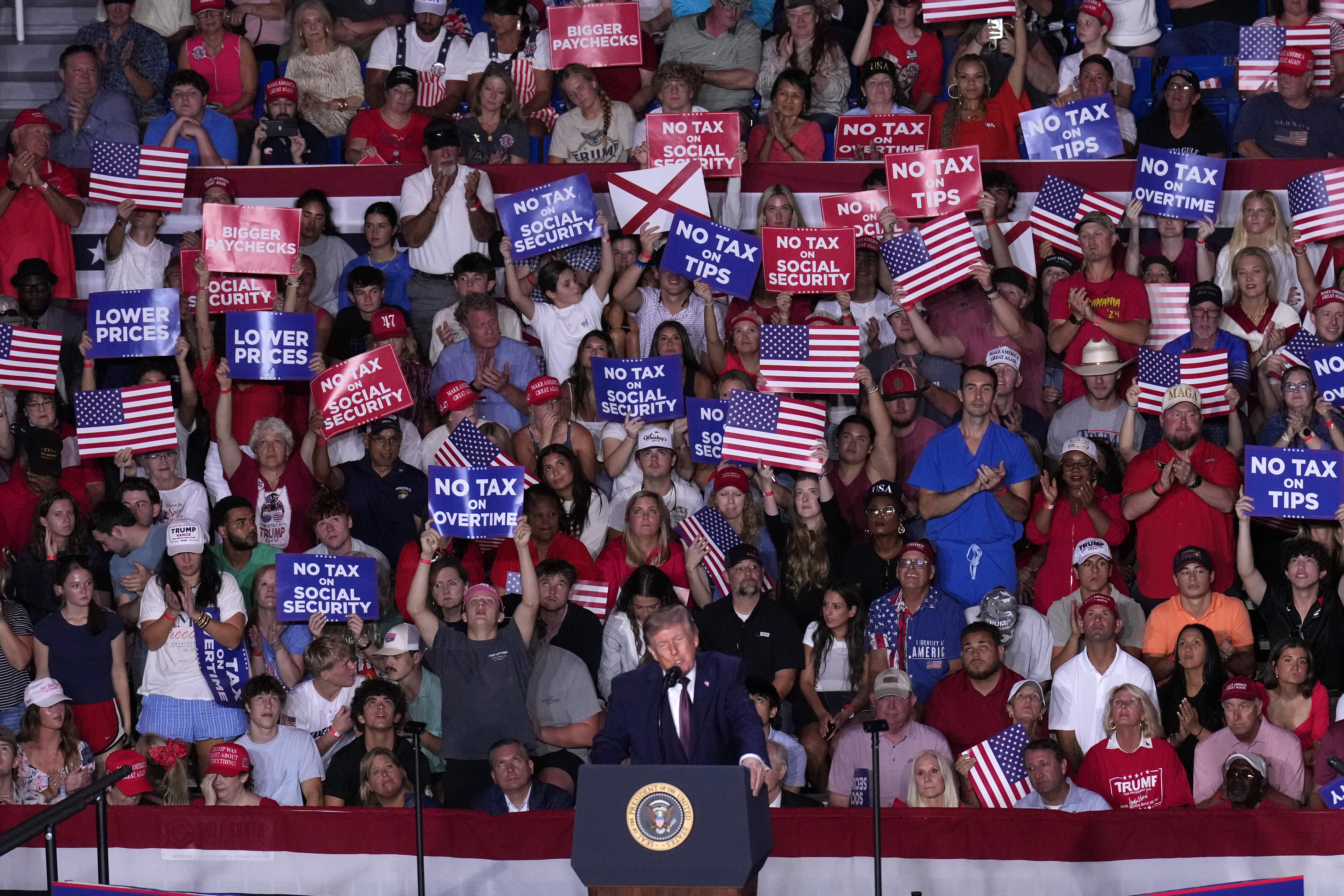 Trump stumps for candidates in deep red Alabama and says he'll be back again next week