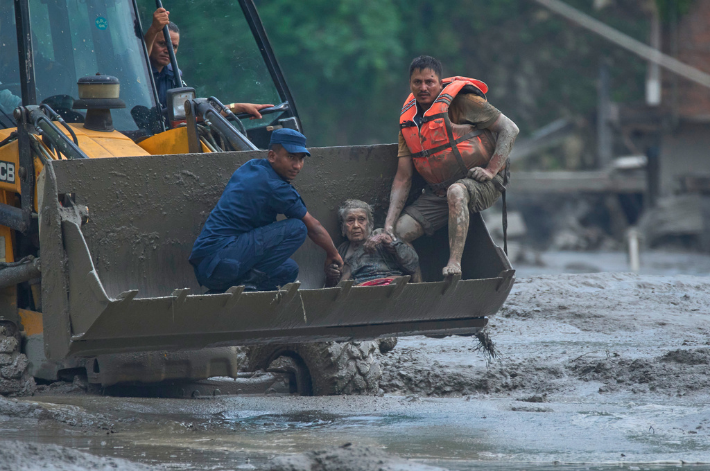 At least 160 killed and hundreds missing, including Americans, after flash floods in Nepal and China