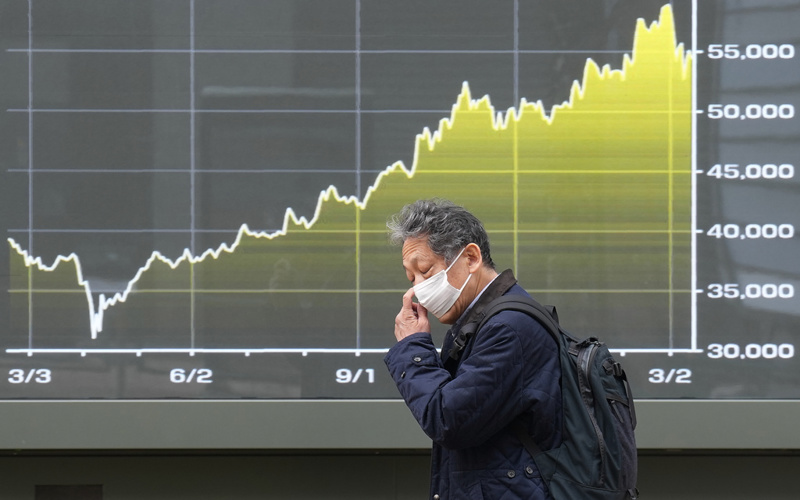 World shares decline, while oil pops above $100 a barrel over Iran war worries
