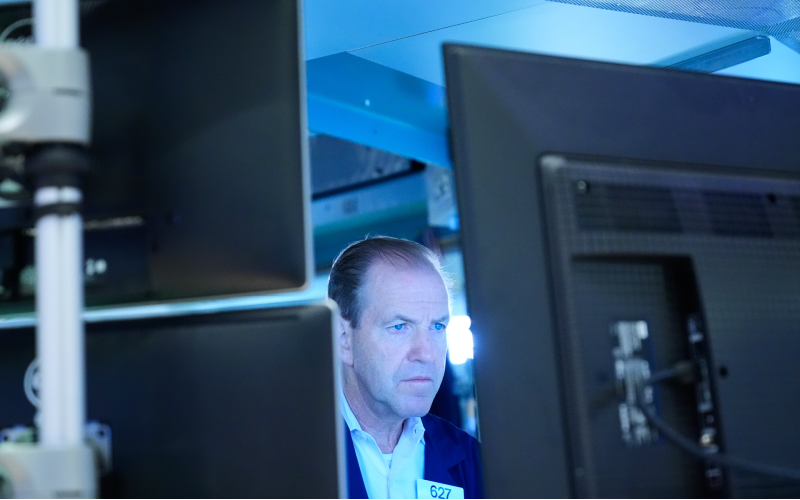 US stocks slip after oil prices and the bond market crank up the pressure